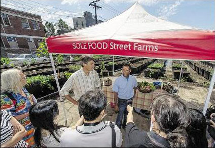 Mayor Gregor Robertson and Solefood's Michael Ableman open the new orchard. PHOTO: WARD PERRIN, PNG, THE PROVINCE 