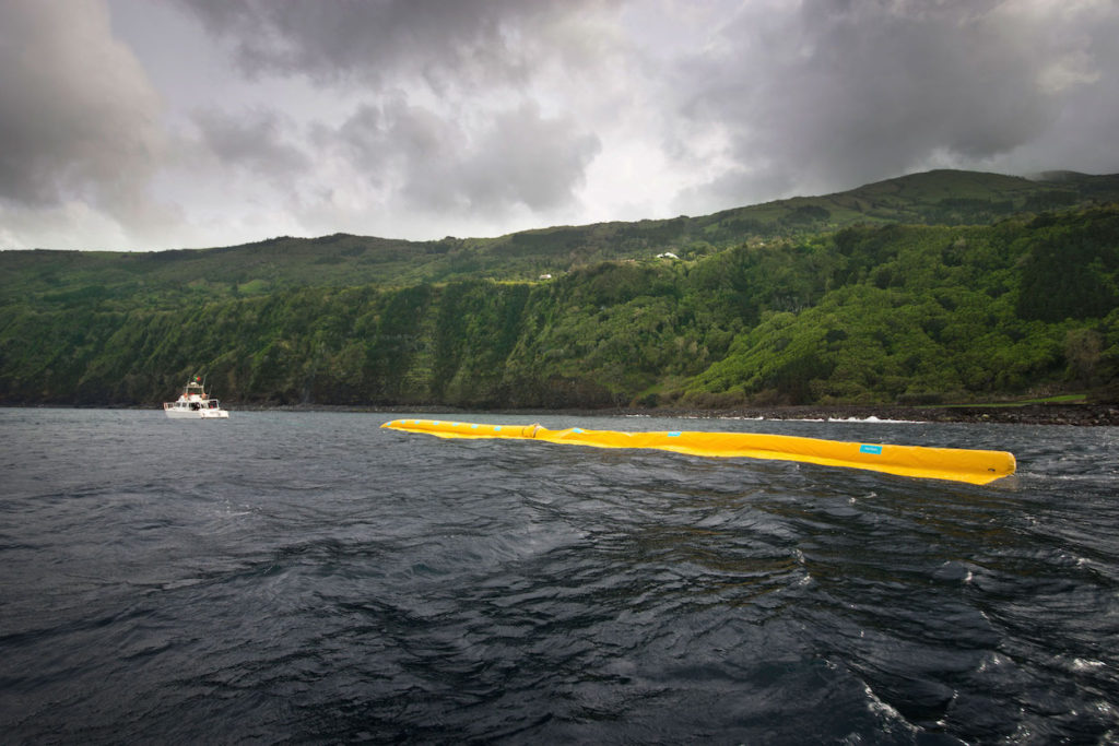 A barrier is being towed into place. Photo courtesy of The Ocean Clean Up